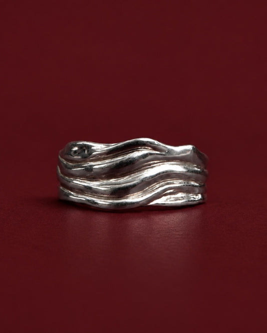 Blurr Ring in 925 recycled sterling silver on burgundy